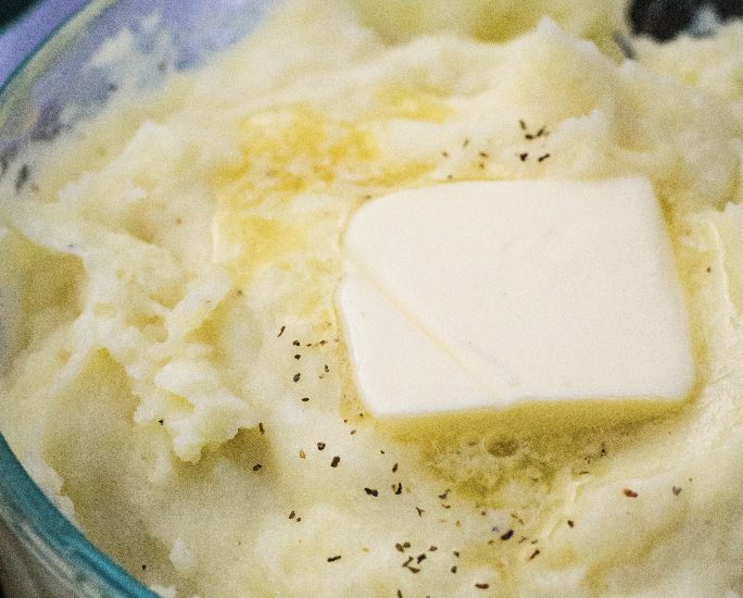 glass dish of homemade mashed potatoes