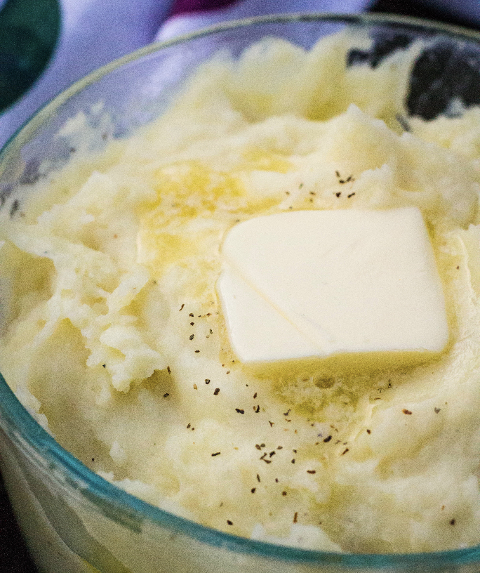 glass dish of homemade mashed potatoes