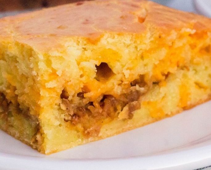 slice of portuguese bola de carne served on a white plate