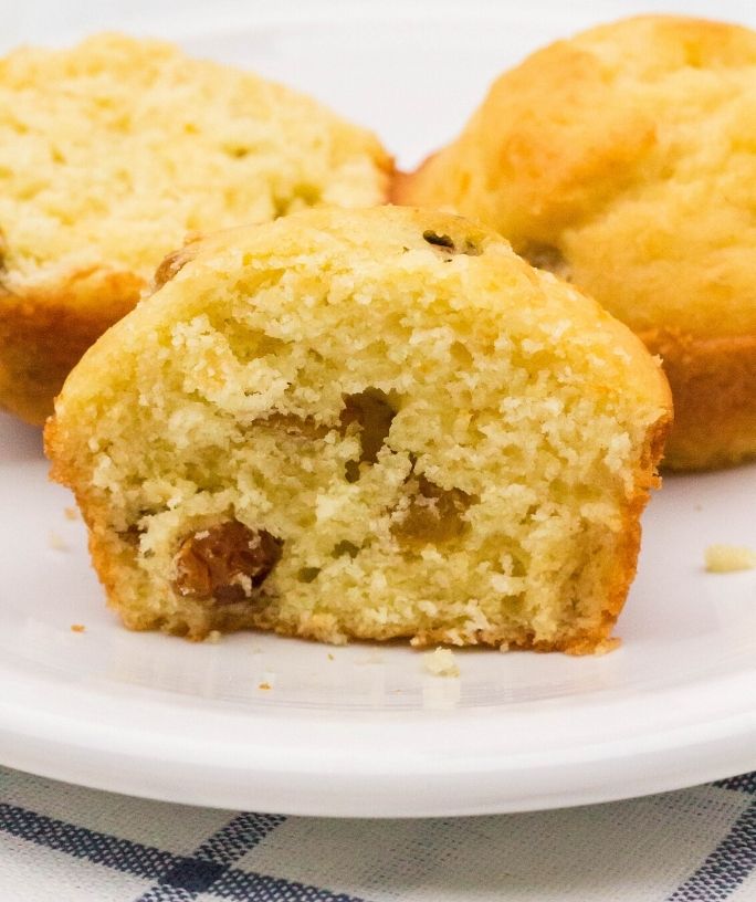 German muffins on a plate, with one muffin cut in half