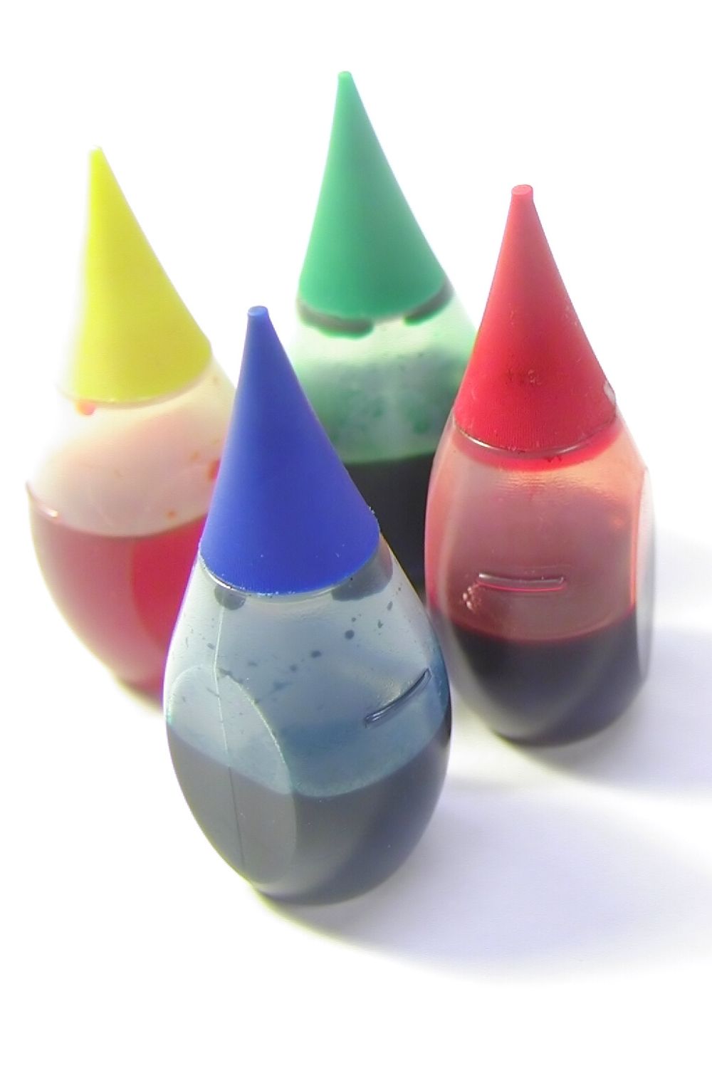 four bottles of liquid food coloring