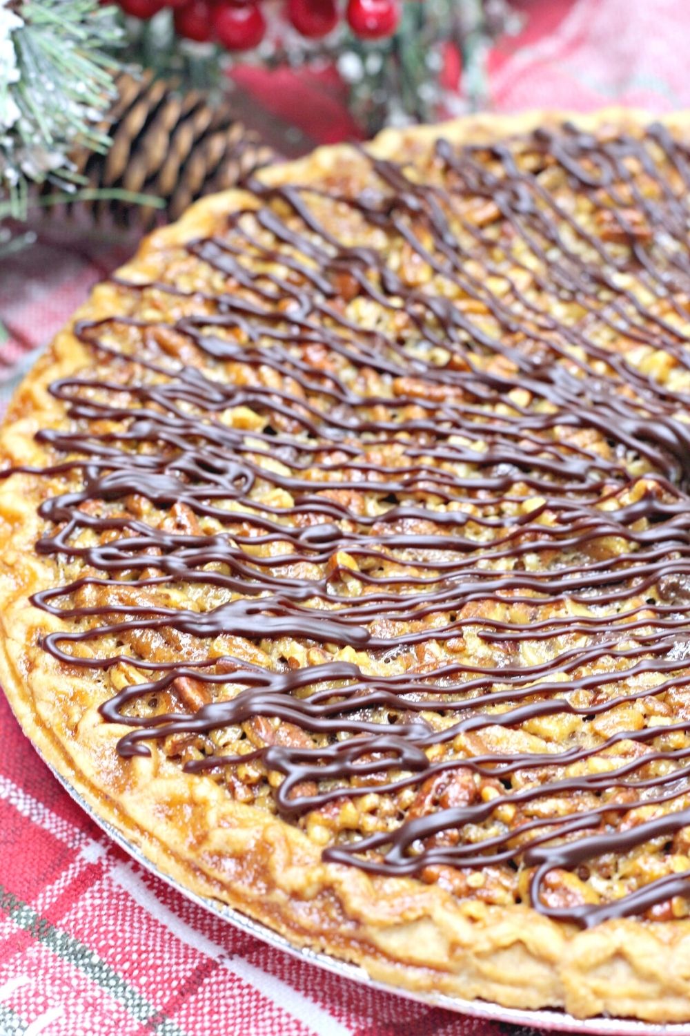 overhead view of the whole turtle pie, drizzled with chocolate and caramel.