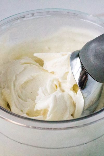 close-up view of an ice cream scoop in a pint of ninja creami frozen yogurt