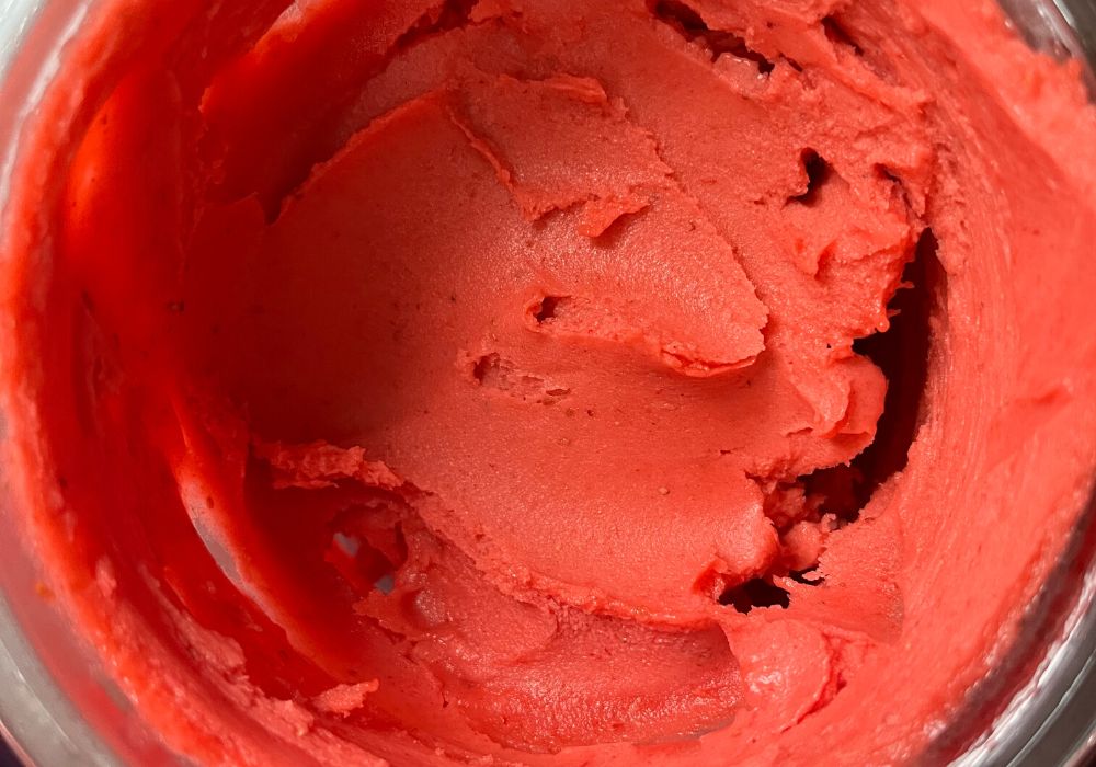 overhead view of a Ninja Creami pint filled with fresh strawberry sorbet