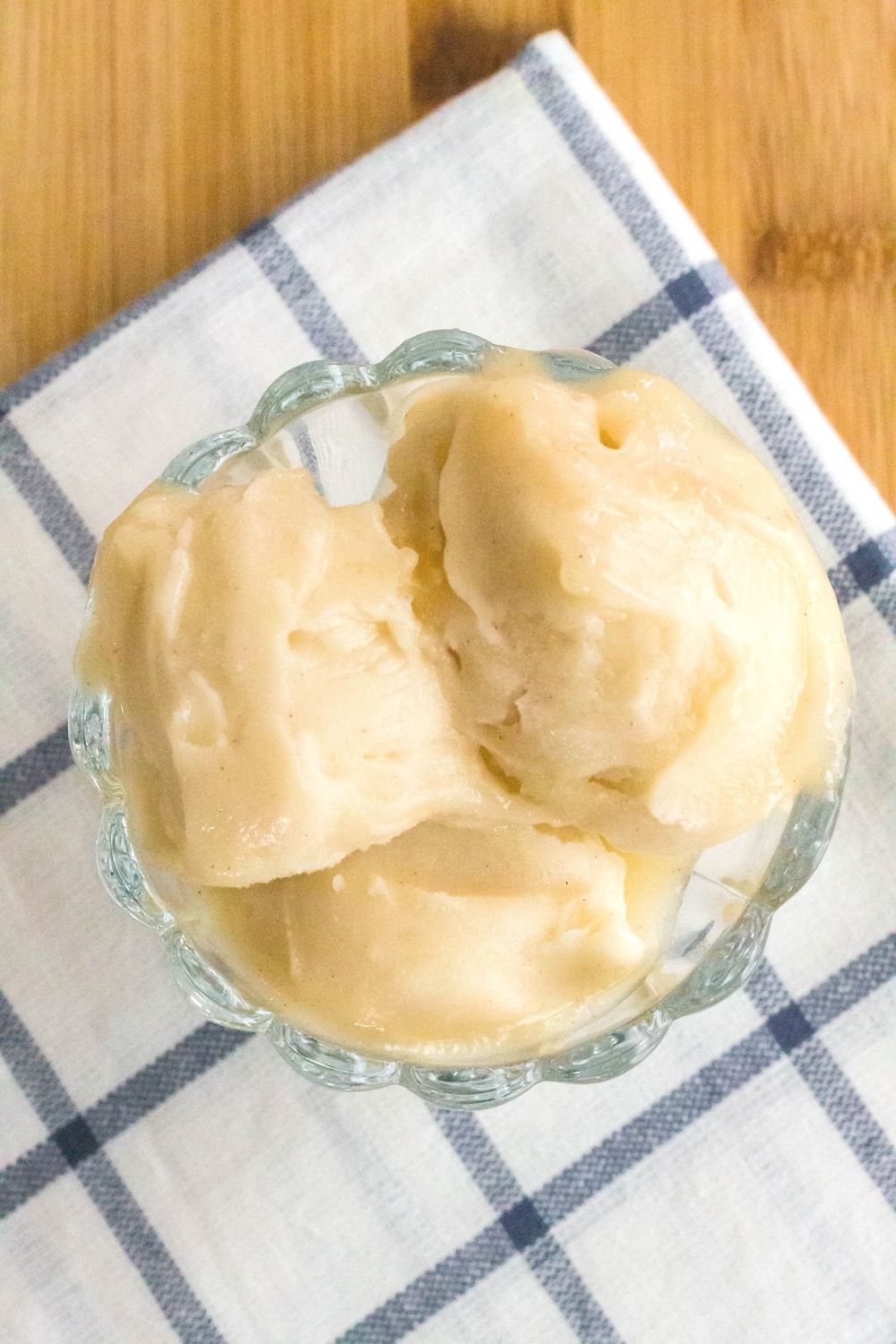 overhead view of three scoops of ninja creami apple pie filling sorbet in a glass dish