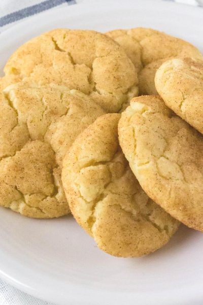 six snickerdoodle cookies without cream of tartar served on a white plate