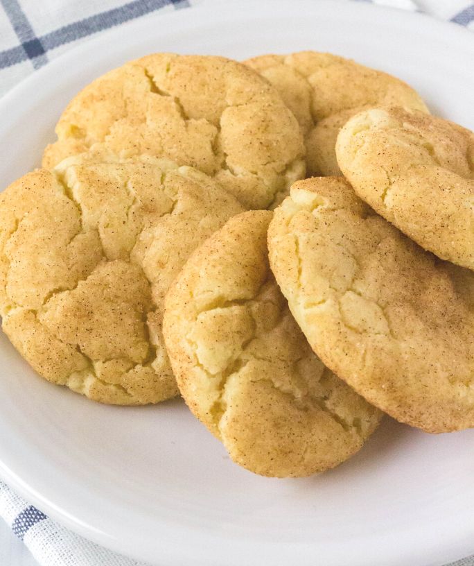 six snickerdoodle cookies without cream of tartar served on a white plate