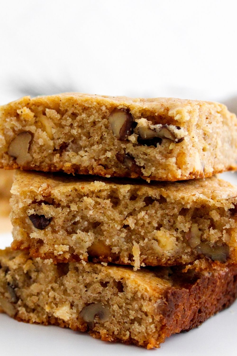 close-up view of eggnog blondies, including the moist cake-like interior and the nuts and spices
