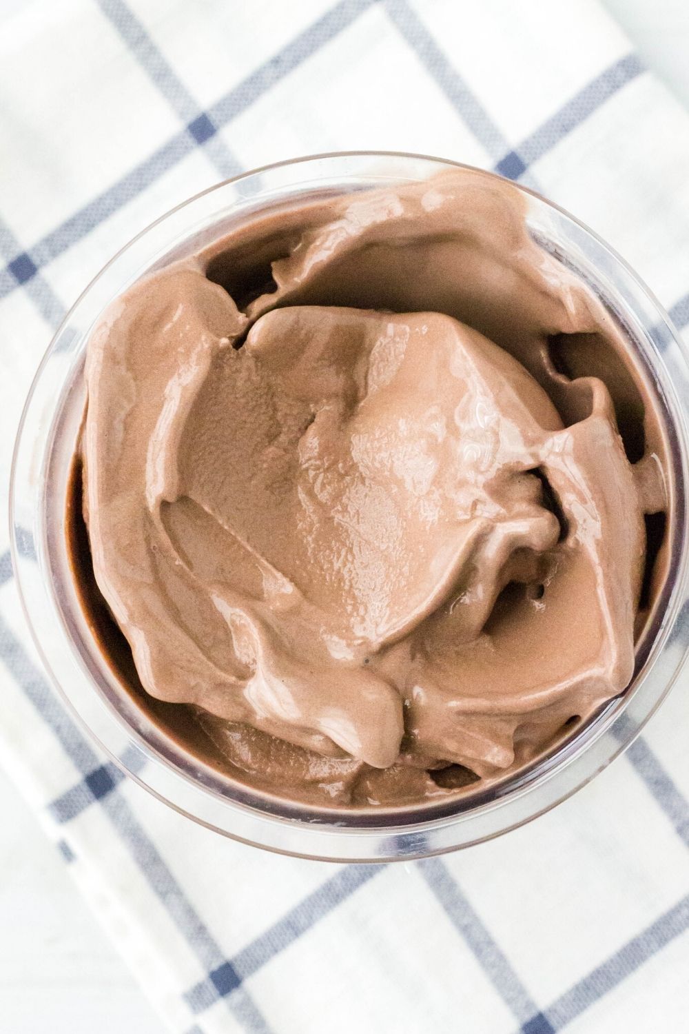 overhead view of a ninja creami pint, showing creamy chocolate ice cream that was made from chocolate milk