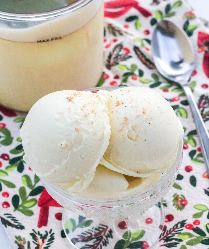 scoops of Ninja Creami eggnog protein ice cream served in a glass dish